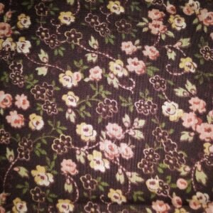 Peach and Yellow Flowers on Brown Background by Quilting Treasures number unknown sold by 1/2 yd.
